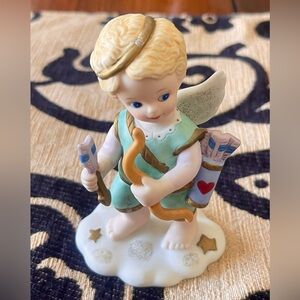Love is in the air Cupid Porcelain Figurine by Katherine Stevenson 1996